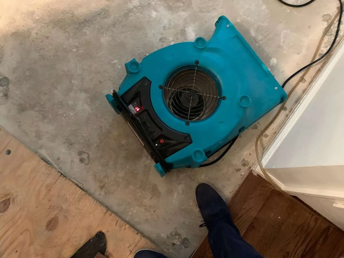 Air mover drying subfloor during Leak Detection & Repair in Peru